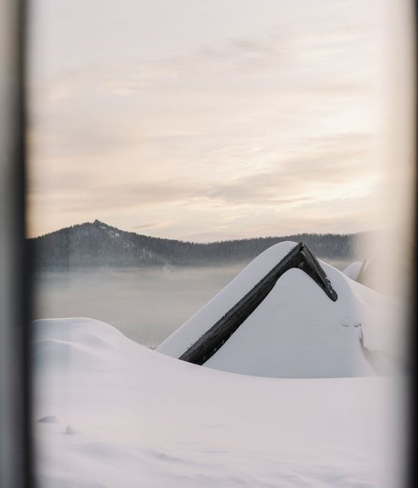 Smiling person stretching outdoors in a park, feeling full of vitality.